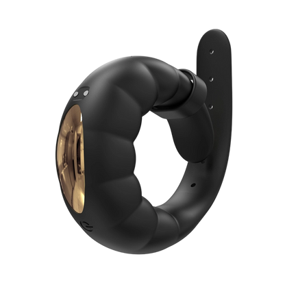 Black and gold cock ring on a white background
